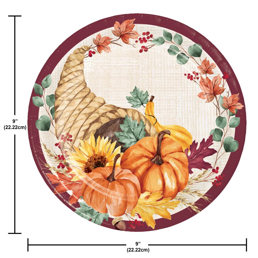 Round decorative plate with autumn-themed design featuring pumpkins, cornucopia, and leaves with measurements.